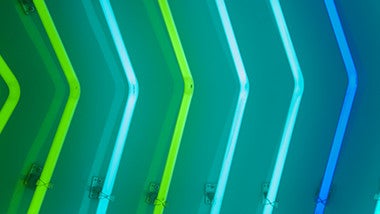 Blue and green neon strip lights, shaped like arrows